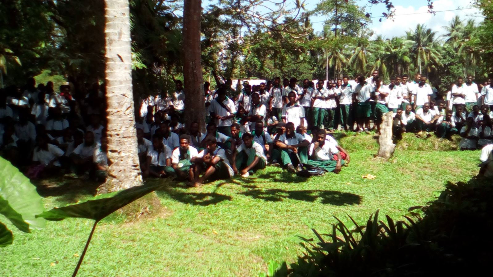 Busu Secondary School Students listening to Aidan Grimes